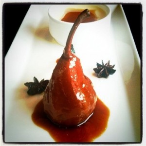 Poached pear with coconut and ginger crème caramel