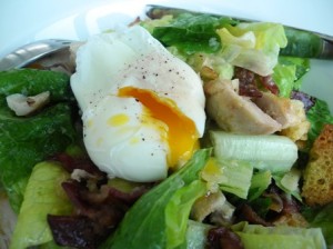 Grilled chicken caesar salad with poached egg