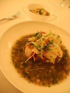 Pacific sea bass on a bed of clams with garlic and red chilli