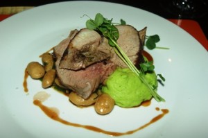 Roast leg of lamb with butter bean cassoulet and pea puree