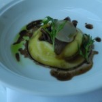 Rouille Raviolo of Organic Egg Yolk, Creamy Potato, Glazed Baby Onions, Irish Coolea Cheese, Mizuna