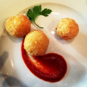 A Carluccio's dish for Taste of Dubai - crispy saffron risotto balls oozing with mozarella