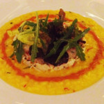 Saffron risotto topped with crabmeat salad and finished with sea urchin emulsion